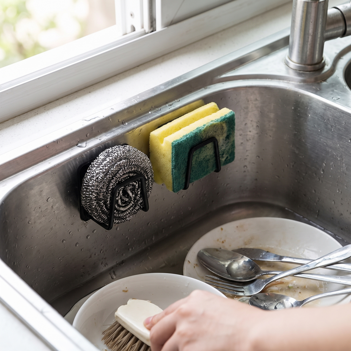 Stainless steel sink sponge holder in use