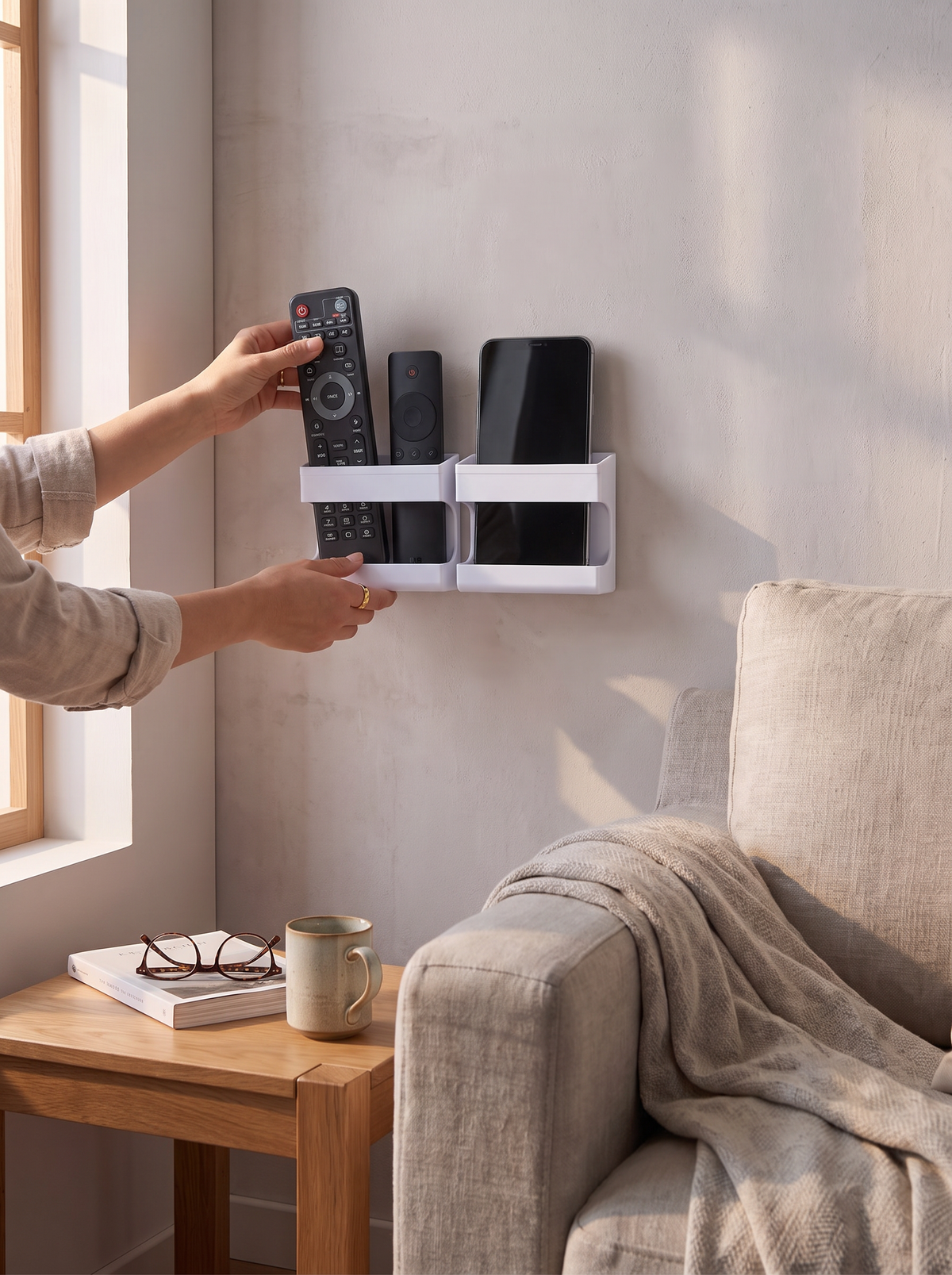 Wall caddy holding remotes securely beside a sofa