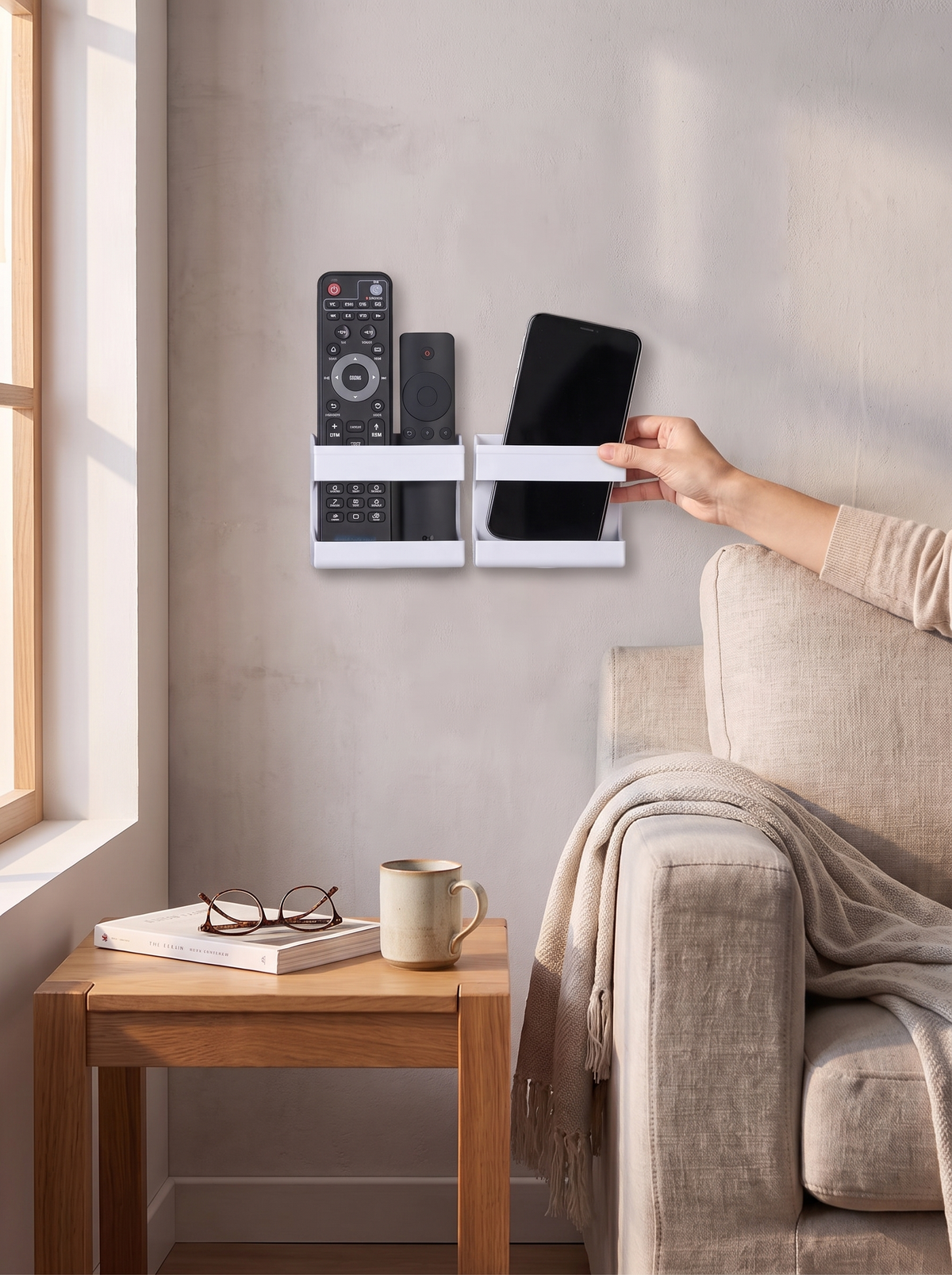 Wall caddy holding remotes and a phone within arms reach