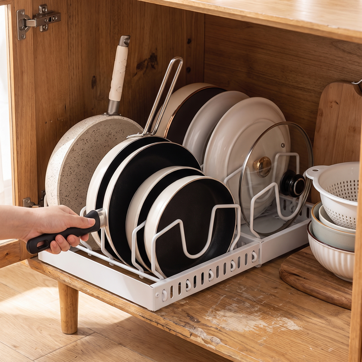 Under cabinet sliding pots and pans organizer in use