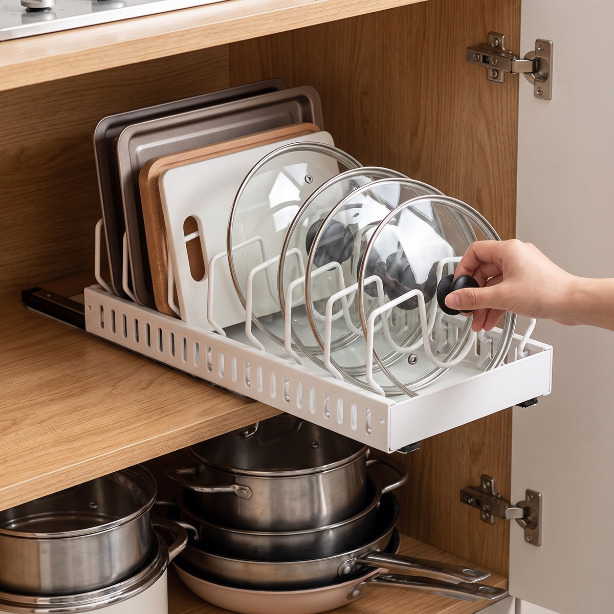 Under cabinet sliding pots and pans organizer in use