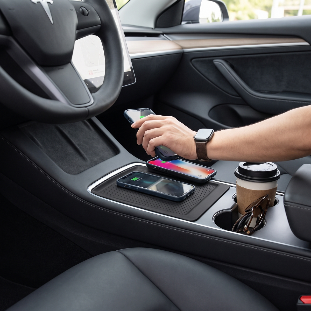 Tesla center console wireless charging pad in use