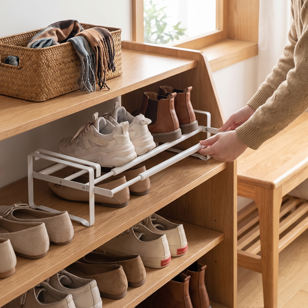 Adjustable under-shelf shoe rack in use
