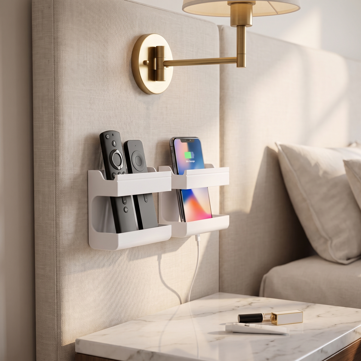 Wall-mounted remote and phone holder beside a bed, phone charging