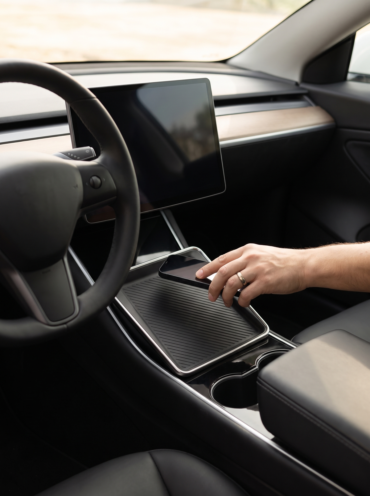 Wireless charging pad in a Tesla centre console
